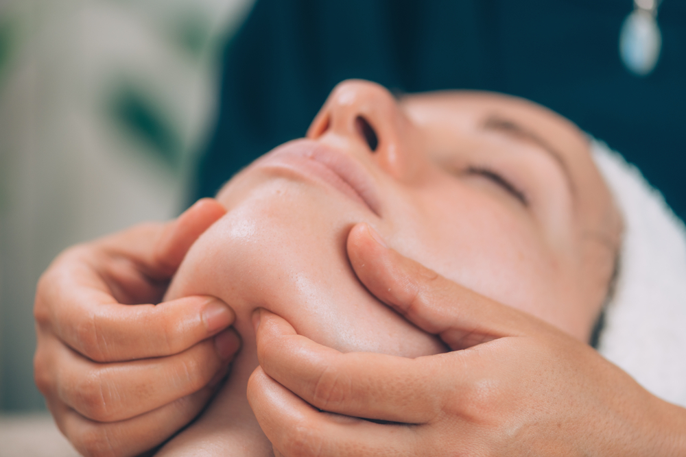 hands of massage therapist massaging shoulders of pregnant lady - Pan Thai Massage - Sugar Lang, TX